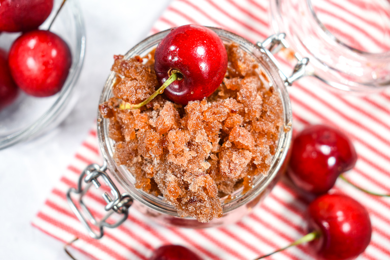 Cherry cola granita, striped red and white towel, and fresh cherries