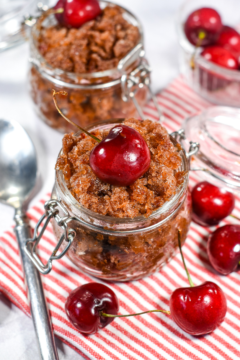 Cherry cola granita, striped red and white towel, and fresh cherries