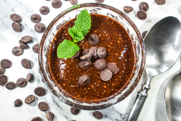 A clear glass dish of cocoa chia pudding