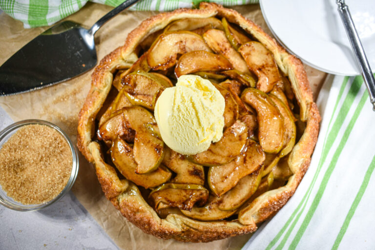 Apple galette with vanilla ice cream and a dish of Demerara sugar