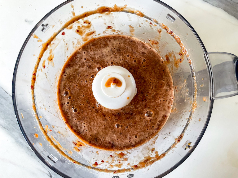 Cherry cola granita mixture in a food processor