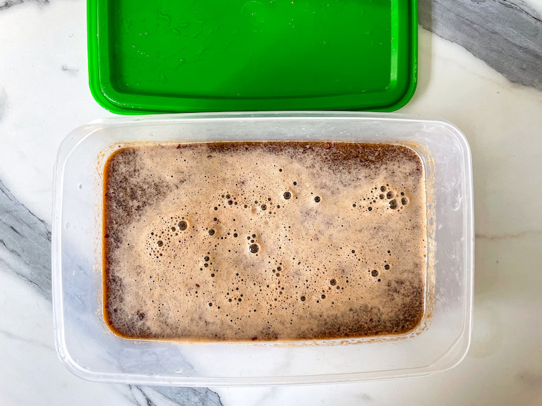 Container with cherry granita mixture