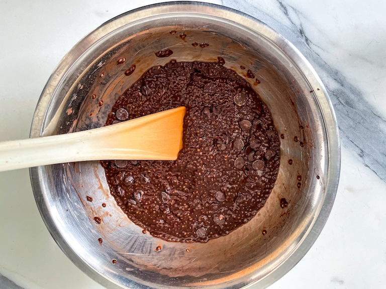 Chocolate chia pudding in a bowl with a spoon