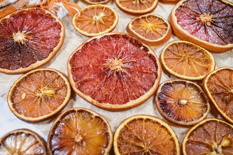 dried citrus fruits on a sheet of parchment