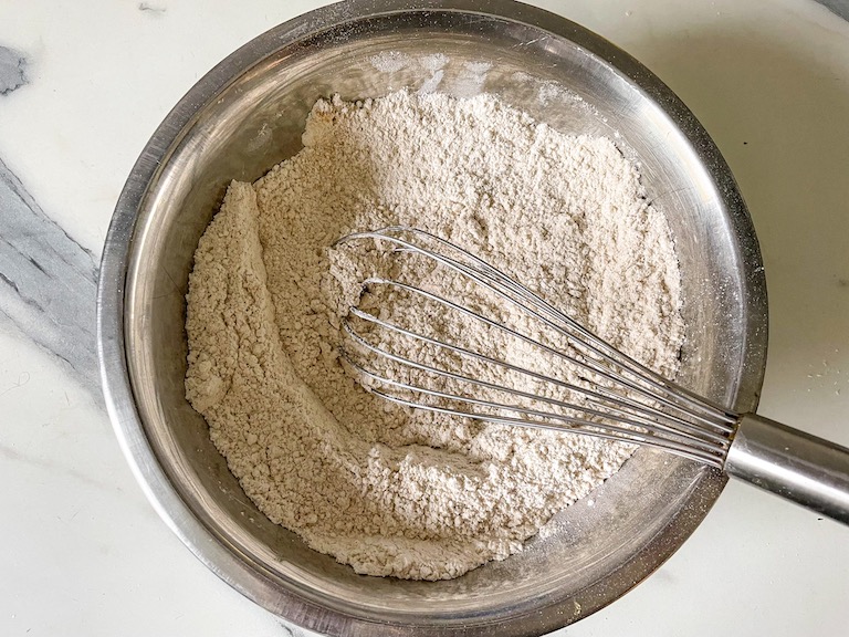 dry ingredients in a bowl with a whisk