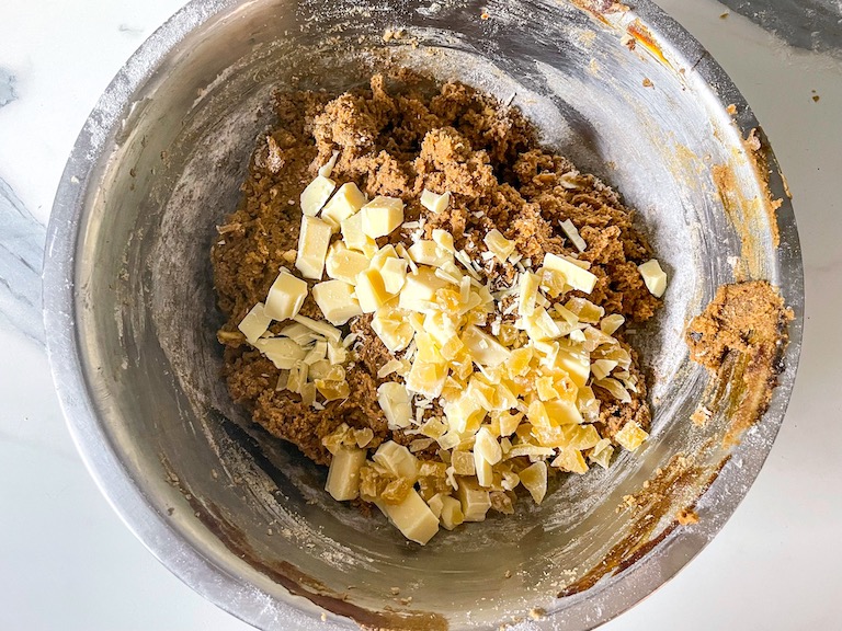 Adding white chocolate chunks to ginger chai cookie dough