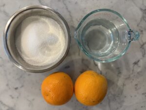 Ingredients for making orange simple syrup