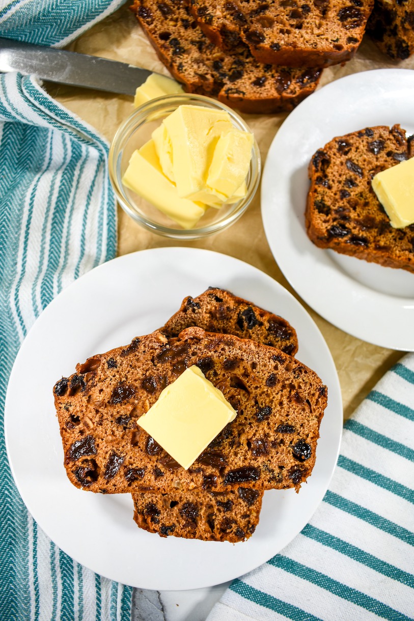 Slices of bara brith bread and a bowl of butter