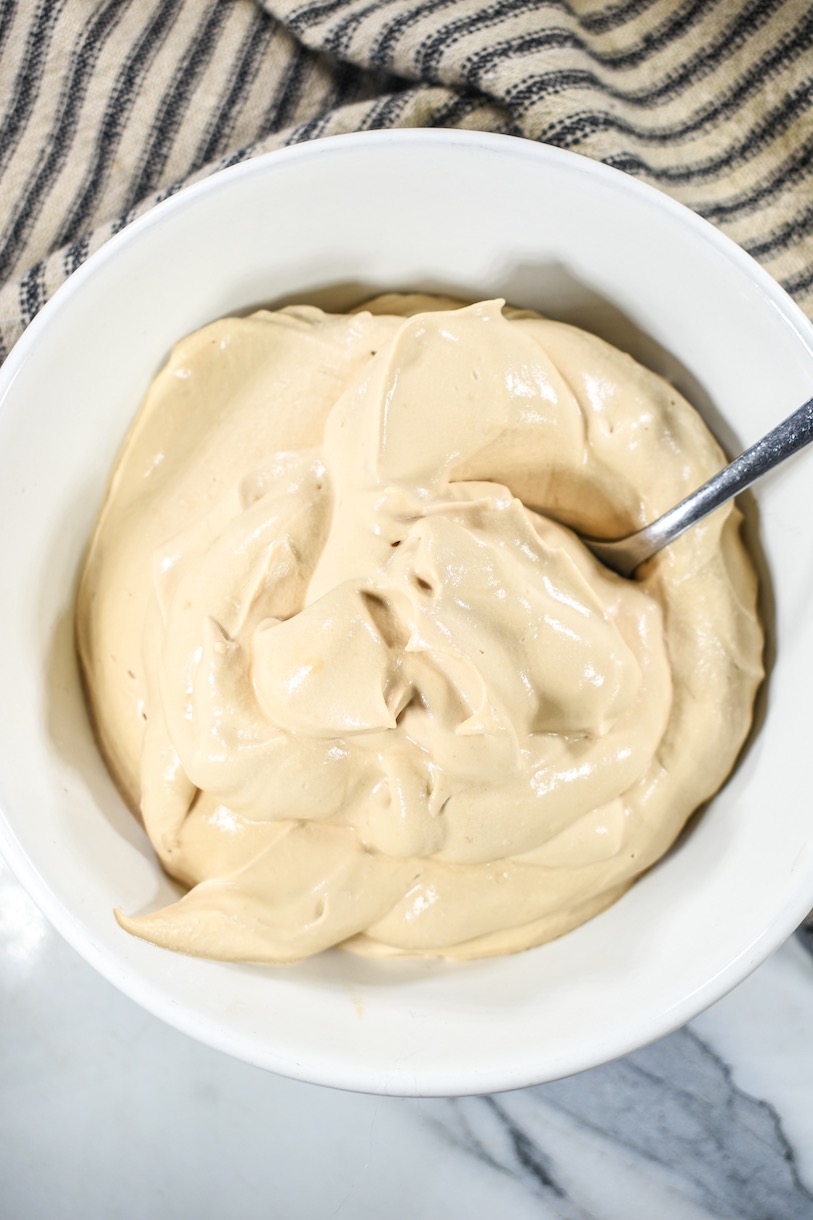 Vertical shot of a bowl of coffee whipped cream