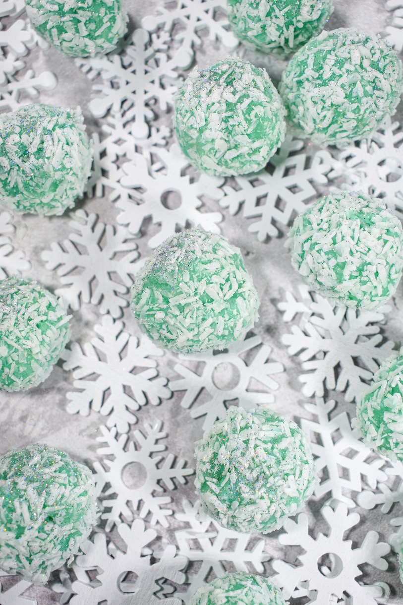 snowball truffles and snowflakes on a white surface