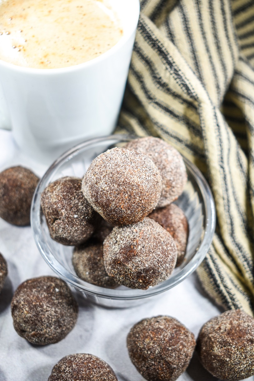 A dish of chai truffles and mug of tea