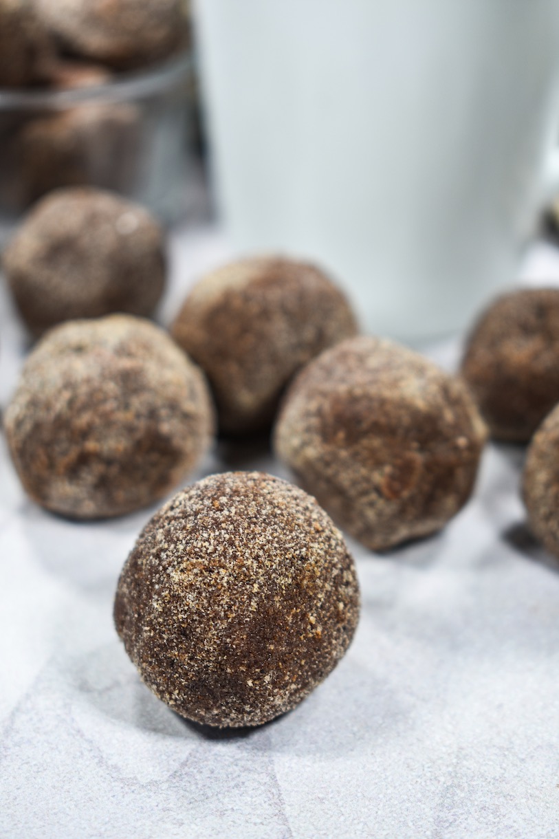 Chocolate chai truffles on a white surface