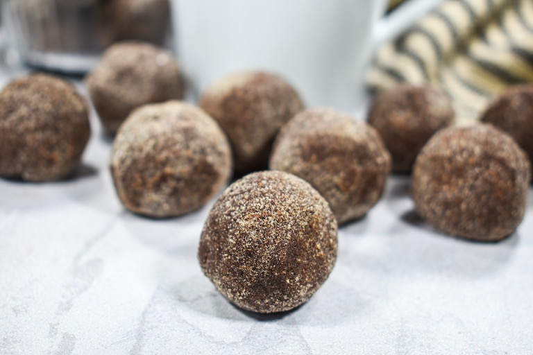 Chai truffles arranged on a white surface