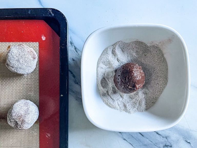 Chocolate truffle in a dish of chai powder