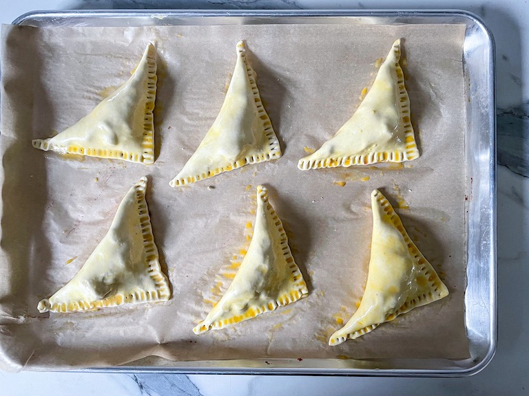 egg washed puff pastry triangles