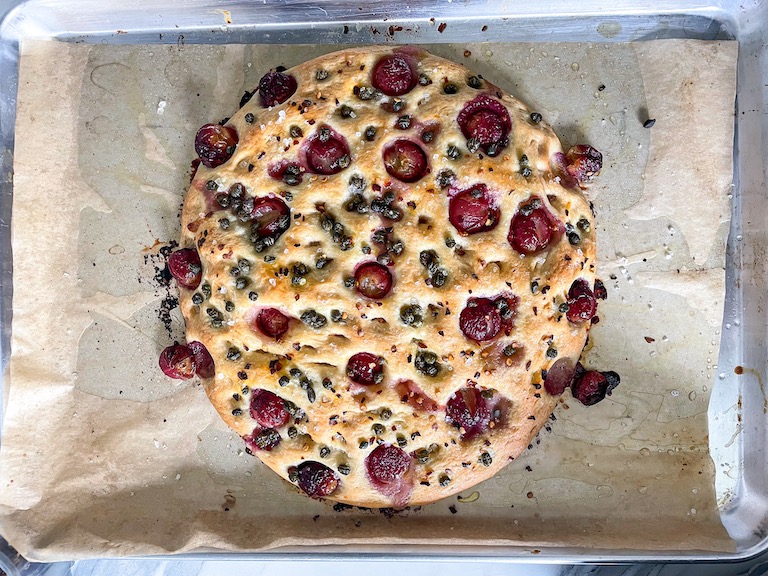 Grape focaccia with chili flakes and capers