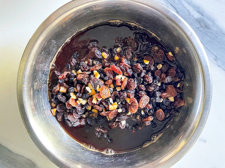 Fruit soaking in a bowl of black tea