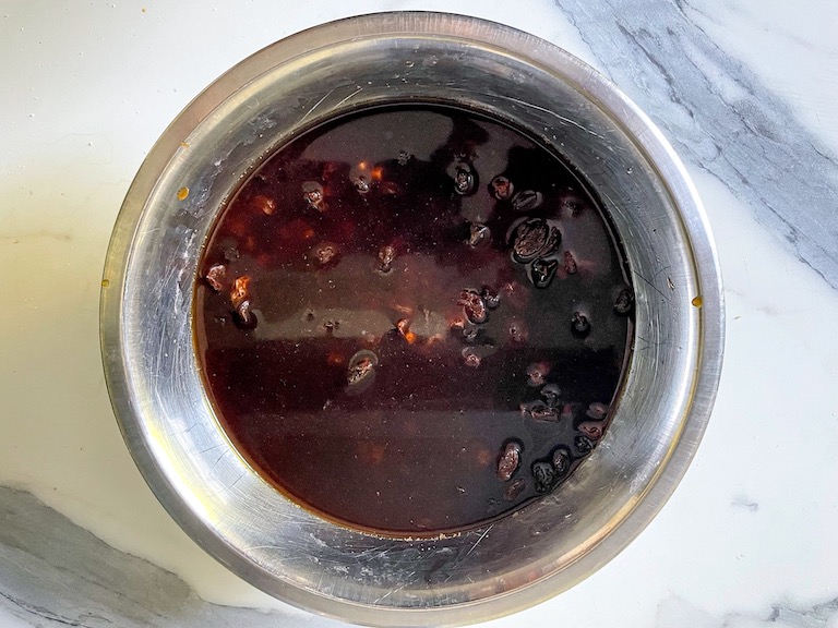 Fruit soaking in a bowl of black tea