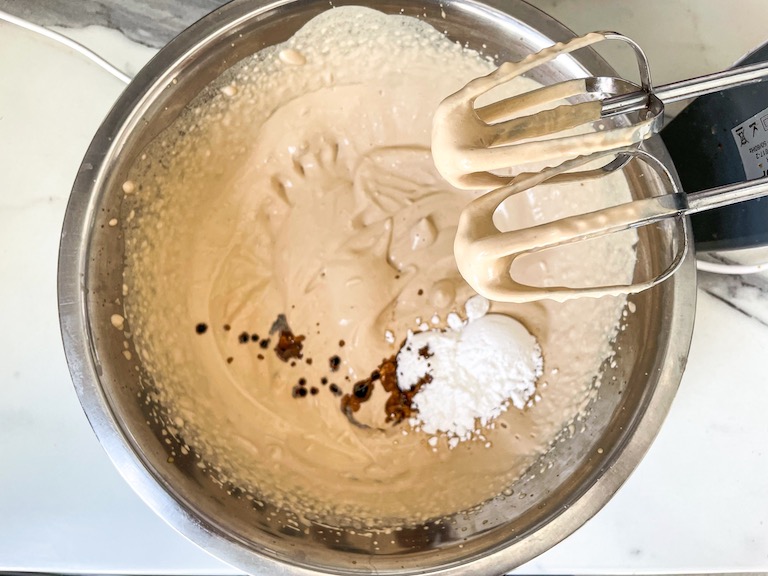 Adding sugar and extract to coffee whipped cream