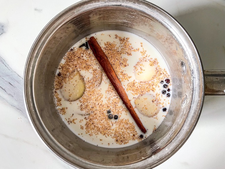 Spices and milk in a saucepan