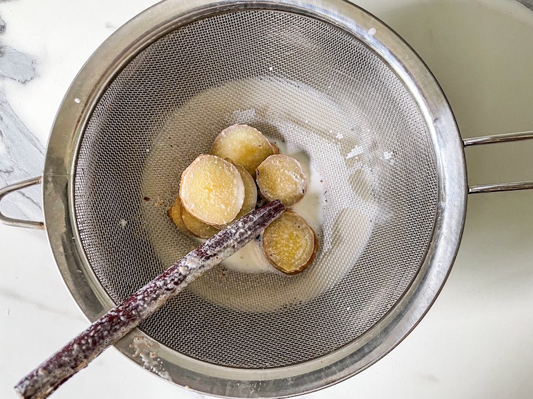 A strainer with whole spices