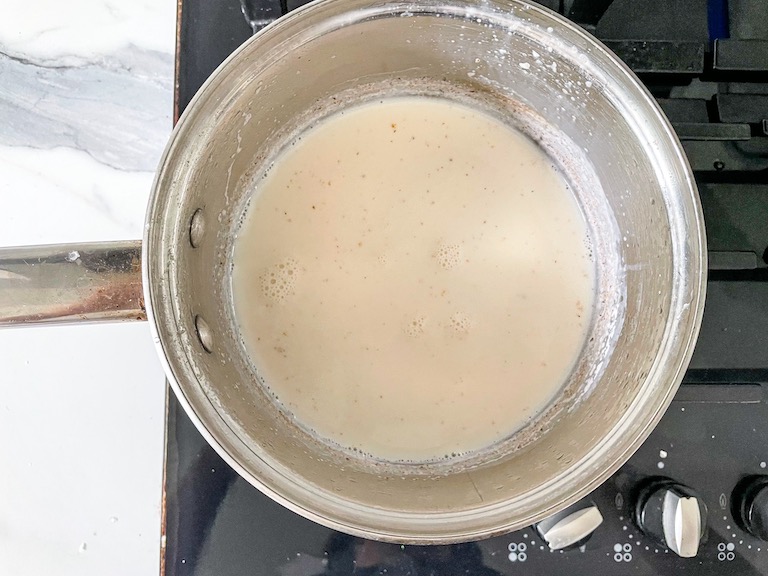 A pan with milk on the stovetop