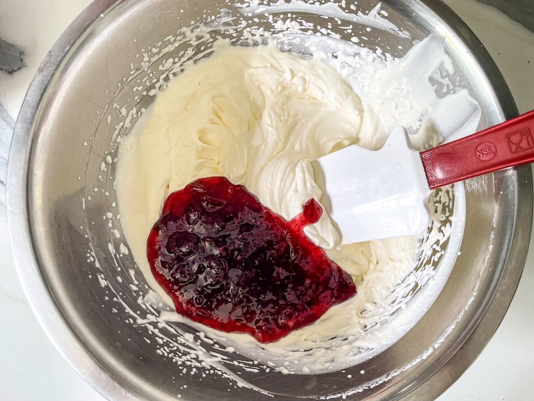 Folding cranberry into whipped cream