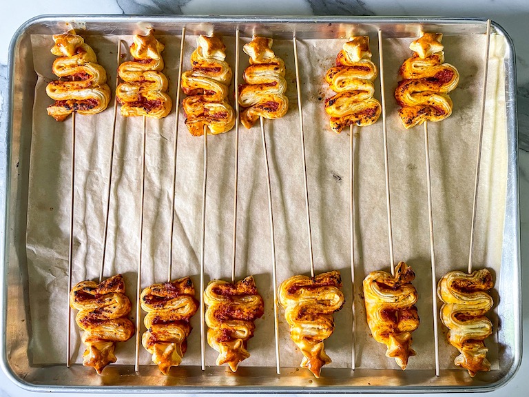 Puff pastry Christmas trees arranged on a tray