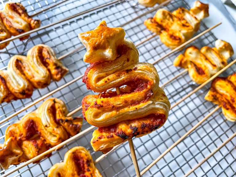 A puff pastry tree on a wooden skewer