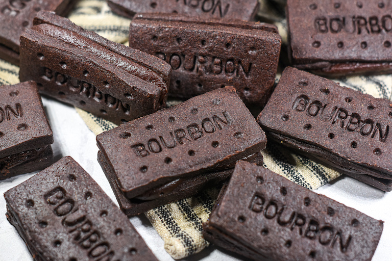 Bourbon biscuits on a striped tea towel