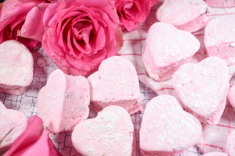 Heart shaped pink rose marshmallows and fresh roses