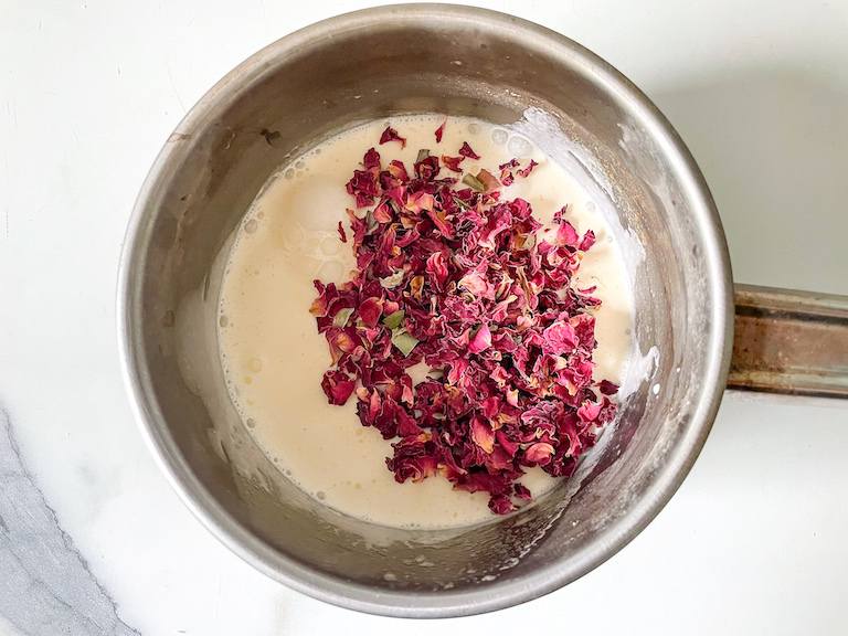 Rose petals in a saucepan of cream