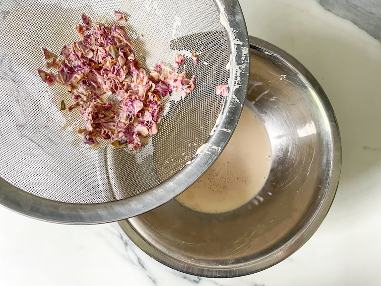 Straining rose petals out of cream