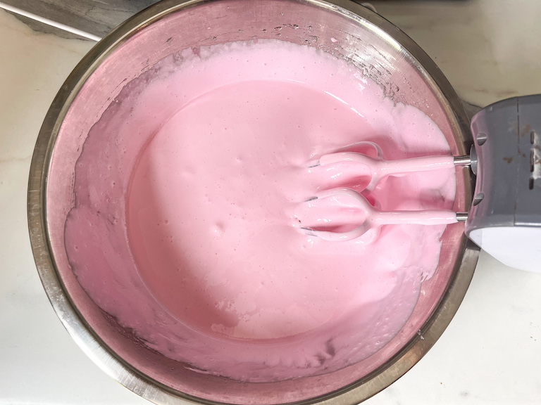 pale pink marshmallow fluff in a bowl