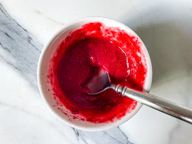 A bowl of raspberry purée