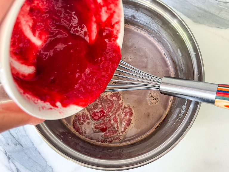 Adding raspberry puree to hot chocolate