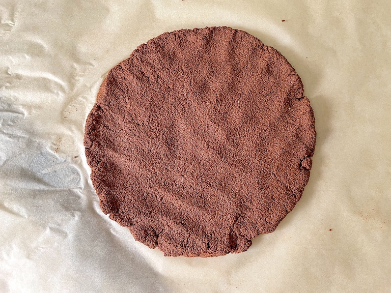 Cinnamon ornament dough on a sheet of parchment