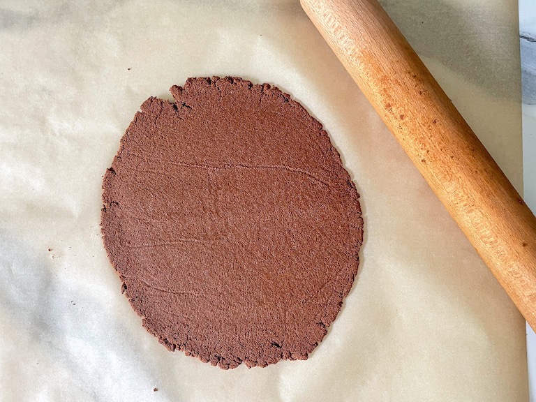 Rolled cinnamon dough and a rolling pin