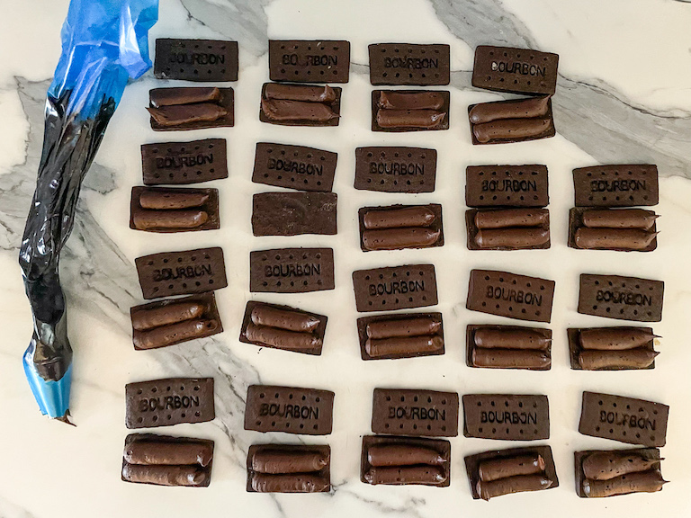 Filing bourbon biscuits with chocolate buttercream