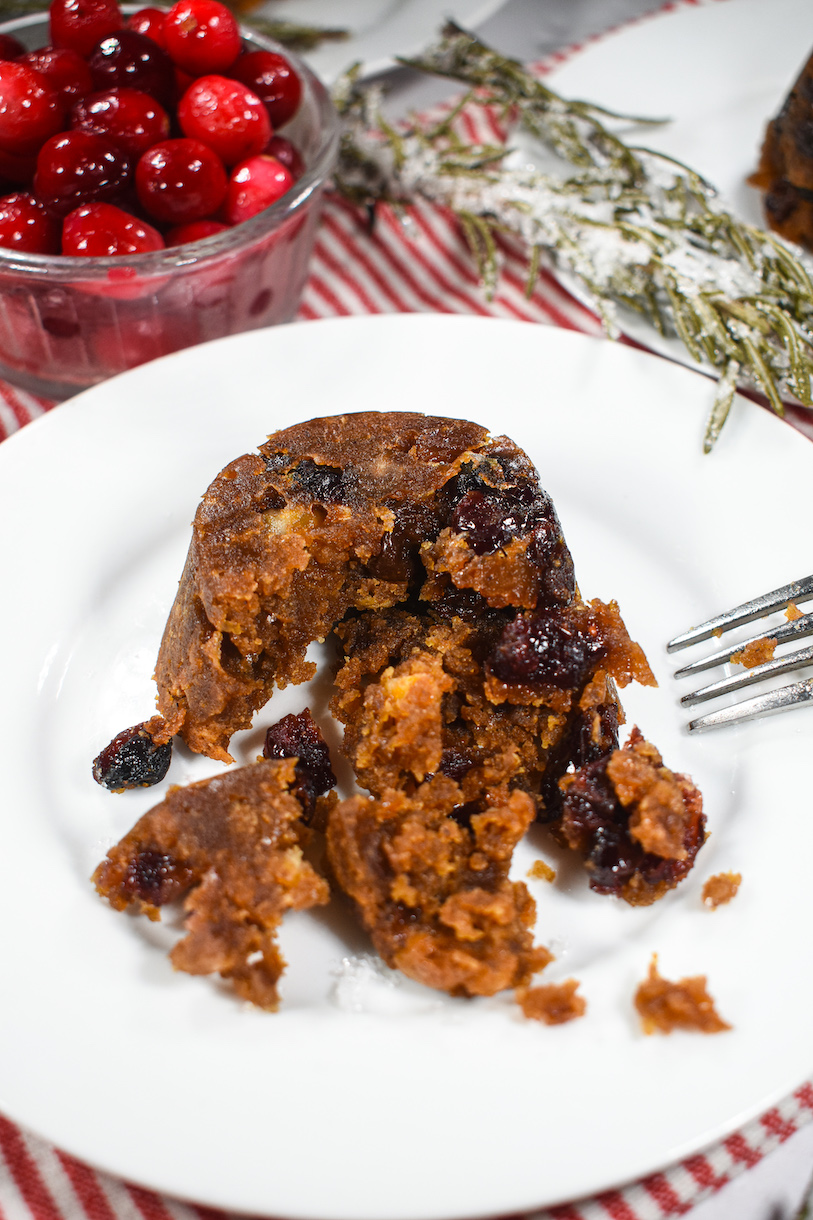 Half eaten Christmas pudding on a plate