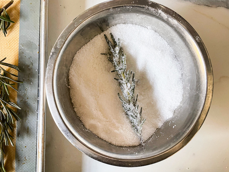 Rosemary in a bowl of sugar