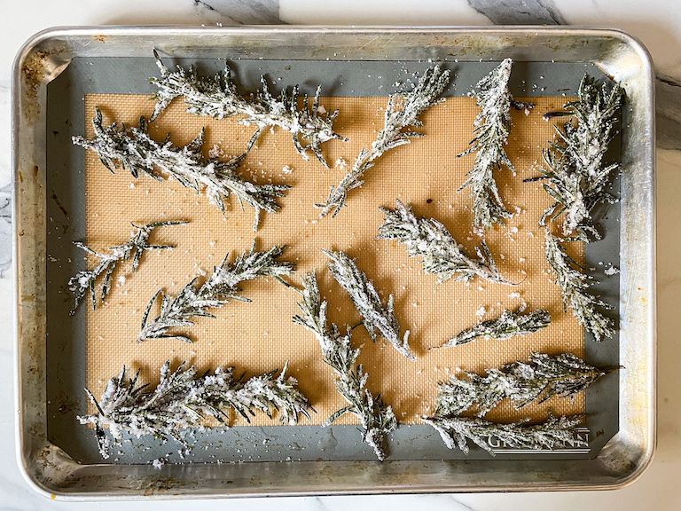 Sugared rosemary arranged on a tray