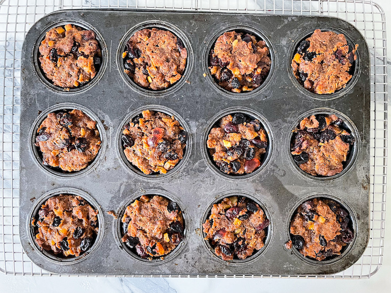 Miniature British Christmas puddings baked in a muffin tin