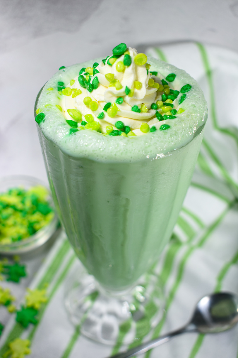 A peppermint milkshake in a tall glass