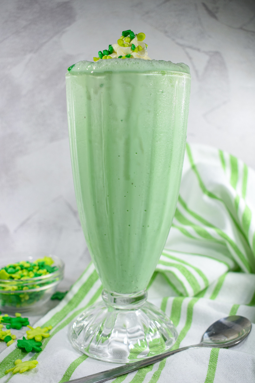 Green milkshake in a tall glass