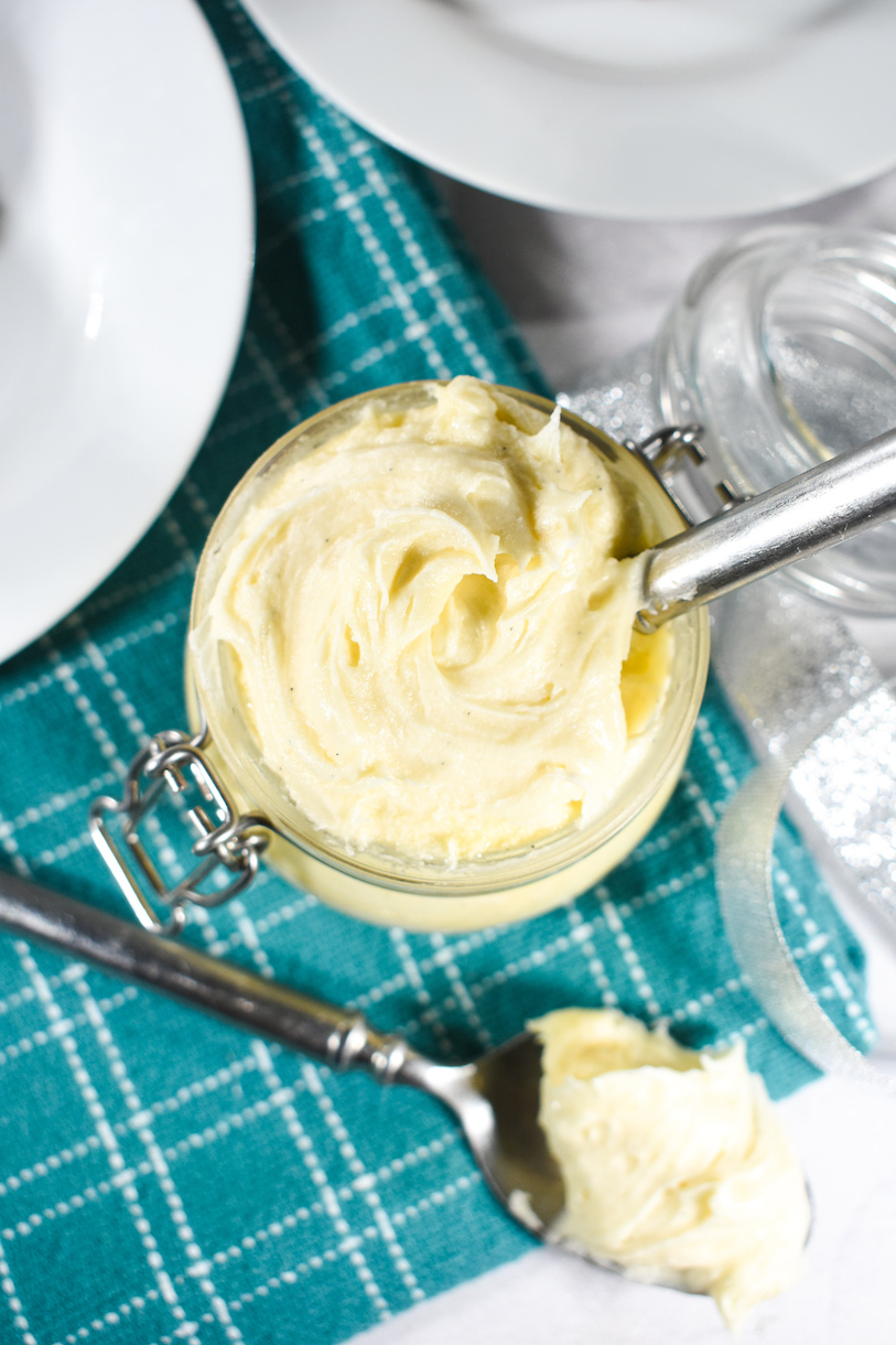 Looking down at swirls of brandy butter in a glass jar