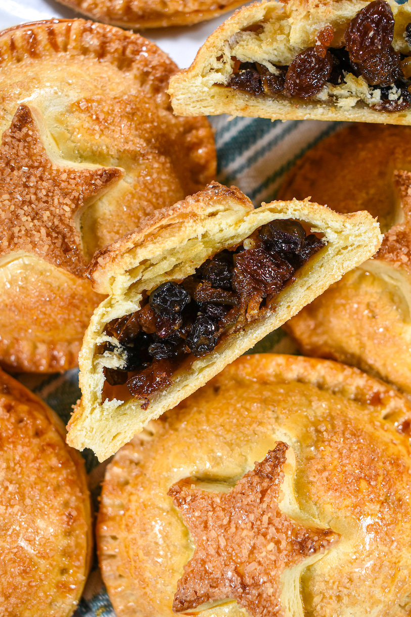 Closeup shot of a sliced mincemeat turnover showing the dried fruit filling inside