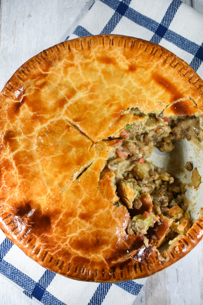 A lentil pot pie with a golden brown pastry crust