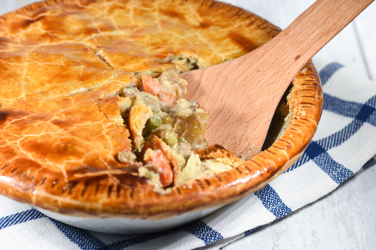 A meatless pot pie with a spoon