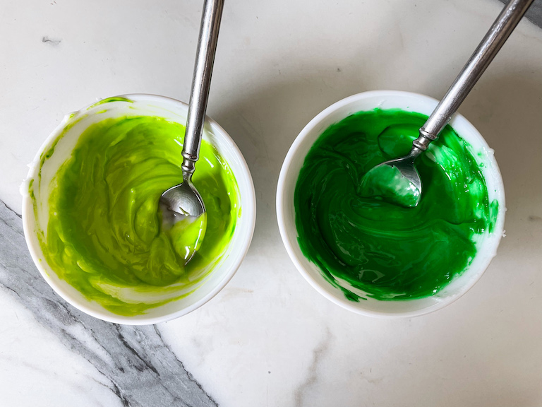 Two bowls of green icing